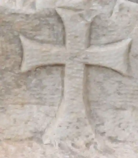 Long cross engraved on a marble stone